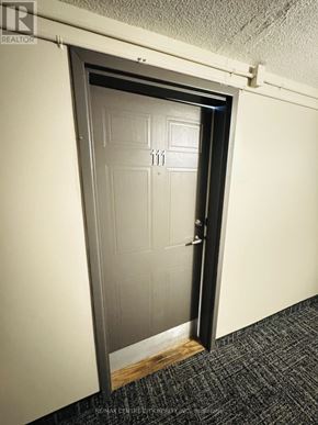 London South (South X) condo for rent - A door with the number 11 on it is open.