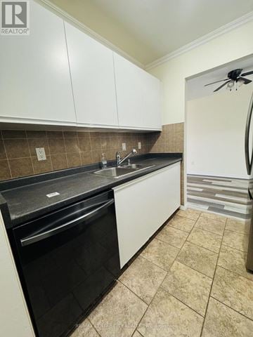 London South (South X) condo for rent - A kitchen with white cabinets and a black dishwasher.