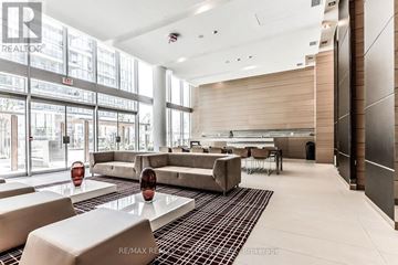 Toronto (Waterfront Communities) condo for rent - A large, modern living room with a long table and chairs.