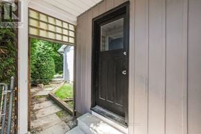 Ottawa apartment for rent - A black door is on the right side of a white wall.