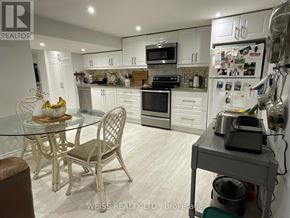 Toronto (Lansing-Westgate) apartment for rent - A kitchen with a table and chairs.