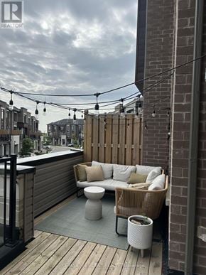 Vaughan (Kleinburg) townhouse for rent - A patio with a couch, table, and chairs.