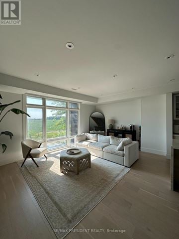 Vaughan (Kleinburg) townhouse for rent - A living room with a white sofa and a large window.
