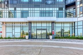 Mississauga (Central Erin Mills) condo for rent - The building in the image is a modern structure with a glass facade and a sign that reads "RE/MAX REALTY SPECIALISTS INC. Brokerage".