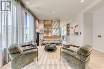 Mississauga (Central Erin Mills) condo for rent - A living room with a grey couch and a yellow rug.