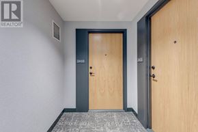 Mississauga (Central Erin Mills) condo for rent - A hallway with two doors, one of which is numbered 2410.