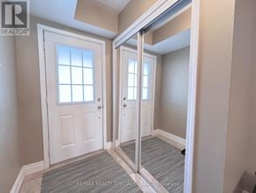 Hamilton (Hamilton Beach) townhouse for rent - A hallway with a white door and a mirrored door.