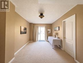 Hamilton (Hamilton Beach) townhouse for rent - A room with a table and chairs set up in front of a window.