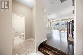 Ottawa townhouse for rent - A white bathroom with a toilet and a sink.