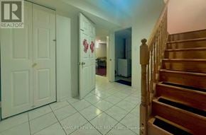Markham (Middlefield) apartment for rent - A hallway with a staircase and a door with a red heart on it.