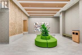 Mississauga (Central Erin Mills) condo for rent - A green plant sits on a green table in a modern office space.
