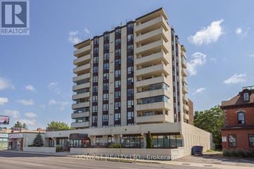 Hamilton (Stinson) condo for rent - A tall building with a sign that says "REALTOR" on it.