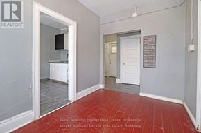 Oshawa (Central) apartment for rent - A room with a red floor and white walls.