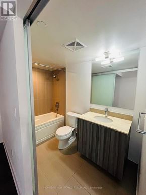 Toronto (Bay Street Corridor) condo for rent - A bathroom with a toilet, sink, and bathtub.
