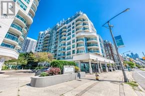 Toronto (Waterfront Communities) condo for rent - A modern multi-story building with a glass facade and a sign that reads "RE/MAX REALTOR".