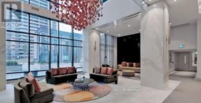 Toronto (Islington-City Centre West) condo for rent - A real estate office with a large window and a view of the city.