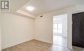 Toronto (Islington-City Centre West) condo for rent - A room with a doorway leading to another room.