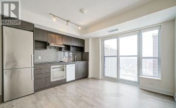 Toronto (Islington-City Centre West) condo for rent - A modern kitchen with stainless steel appliances and wooden cabinets.