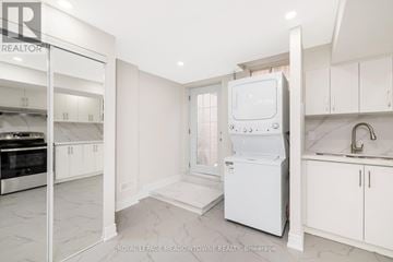 Milton (Be Beaty) apartment for rent - A white kitchen with a dishwasher and a refrigerator.