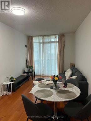 Mississauga (City Centre) condo for rent - A dining area with a table set for four.