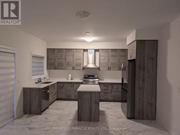 Wellington North (Arthur) apartment for rent - A modern kitchen with wooden cabinets and a marble floor.