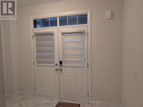 Wellington North (Arthur) apartment for rent - A white door with a window above it in a room.