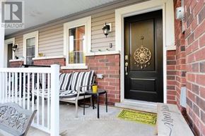 Shelburne townhouse for rent - A black door with a gold doorknob is on a brick house.