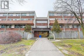 Toronto (Tam O'shanter-Sullivan) condo for rent - A building with a sign that says REALTOR in the top left corner.