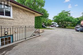 Mississauga (Clarkson) apartment for rent - A house with a sign that says REALTOR in the window.