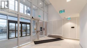 Toronto (Islington-City Centre West) condo for rent - A modern kitchen with a dining table set for two.