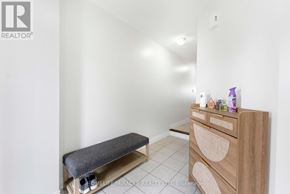 Oshawa (Taunton) townhouse for rent - A room with a bench and a dresser with a mirror above it.