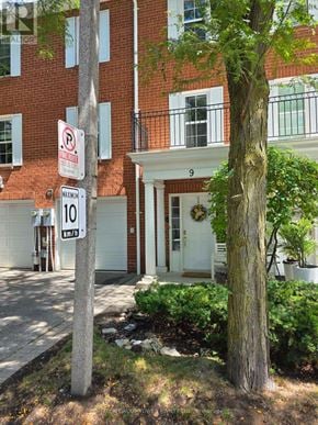 Brampton (Fletcher's Creek South) townhouse for rent - A sign on a pole in front of a building indicates a speed limit of 10 km/h.