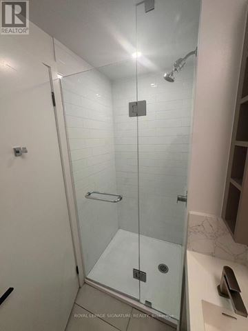 Toronto (Church-Yonge Corridor) condo for rent - A white bathroom with a glass shower stall.