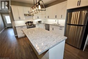 Seaforth townhouse for rent - A kitchen with a granite countertop and stainless steel appliances.
