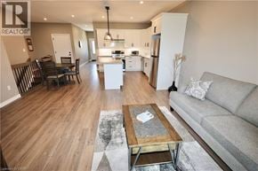 Seaforth townhouse for rent - A living room with a grey couch and a coffee table.
