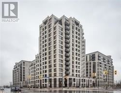 Markham (Unionville) condo for rent - A large building with a Realtor sign in the corner.