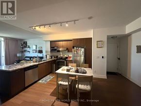 Markham (Unionville) condo for rent - A kitchen with a table and chairs in the middle of it.