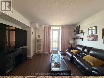 Markham (Unionville) condo for rent - A living room with a black leather couch and a flat screen TV.