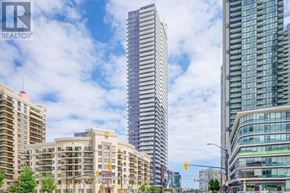Mississauga (City Centre) condo for rent - A cityscape with a mix of modern and older buildings, with the tallest building in the center.