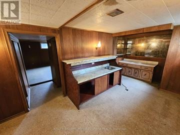 Toronto (Newtonbrook East) apartment for rent - A kitchen area with a sink and a refrigerator.