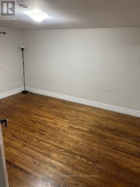 Ajax (South East) apartment for rent - A room with wooden flooring and a lamp on the floor.