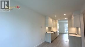 North Vancouver townhouse for rent - A realtor logo is on a key in a kitchen.