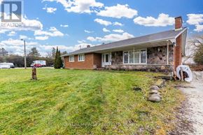 Halton Hills (Rural Halton Hills) apartment for rent - A house with a lawn in front of it.