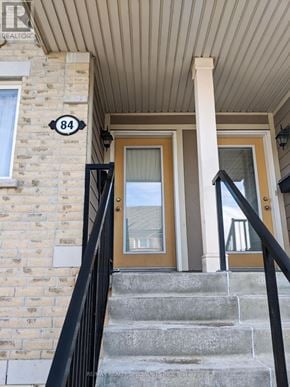 Mississauga (Churchill Meadows) townhouse for rent - A brown door with a glass window is on the front of a house.