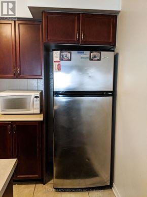 Mississauga (Churchill Meadows) townhouse for rent - A stainless steel refrigerator with a freezer drawer and a water and ice dispenser.