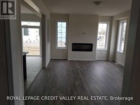 Haldimand apartment for rent - A living room with a fireplace and a tv on the wall.