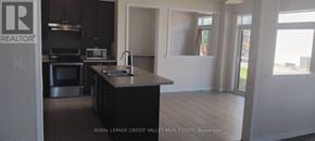 Haldimand apartment for rent - A kitchen with a black counter top and stainless steel appliances.