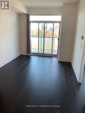 Toronto (Bayview Village) condo for rent - A room with a sliding glass door leading to a balcony.