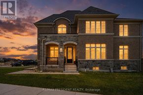 Adjala-Tosorontio (Colgan) apartment for rent - A house with a stone facade and a large front porch is illuminated by the setting sun.
