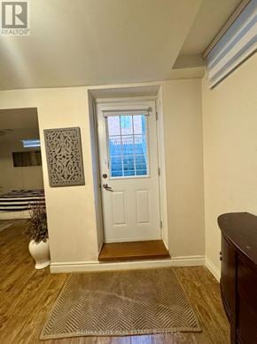 Richmond Hill (Westbrook) apartment for rent - A white door with a window above it in a room.
